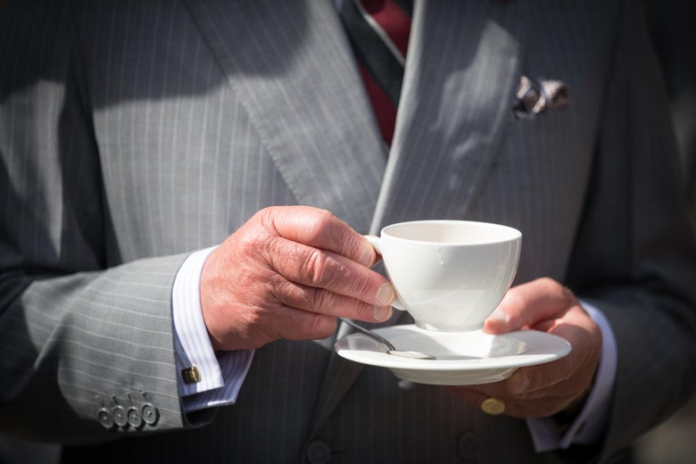 Prince Charles, Prince of Wales has a cup of tea as he takes a tour of the gardens at Plas Cadnant Hidden Gardens.